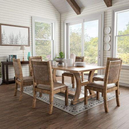 Add rustic charm to your modern farmhouse dining area with the seven-piece dining set, which features rustic pine wood construction. The dining table offers a spacious plank-style tabletop surface and rests on a trestle-style base with curved C-shaped legs and a center beam that lend an understated charm while providing ample support. Chairs feature light brown faux leather with classic nail head trims. About Furniture of America Furniture of America is proud to be the family friend that always has your back. We are more than just a business. Our customer care team is part of a larger FOA community dedicated to delivering a happy home. So browse our selection and invite warmth and character into every room in your home. Rustic Materials, Matching Chairs, Table Frame, Dining Table Set, Large Table, Furniture Of America, Laurel Foundry Modern Farmhouse, Farmhouse Dining, Rectangular Dining Table