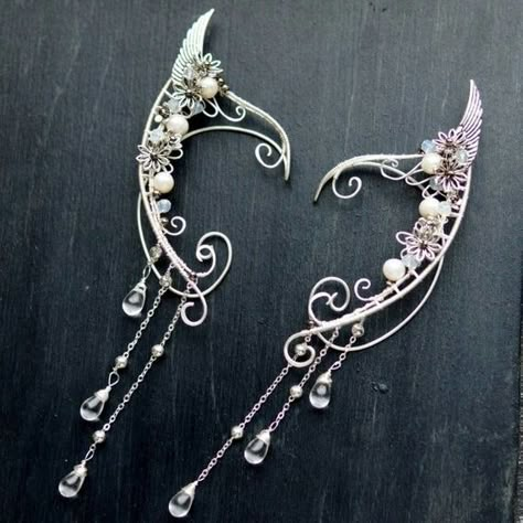 https://www.etsy.com/listing/512928774/elven-ears-a-pair-earcuffs-elf-ears?ref=shop_home_active_26 Elven Ears, Elf Jewelry, Elf Ear Cuff, Elf Ear, Fairy Ears, Elven Jewelry, Wire Wrapped Jewelry Diy, Fantasy Decor, Elf Ears