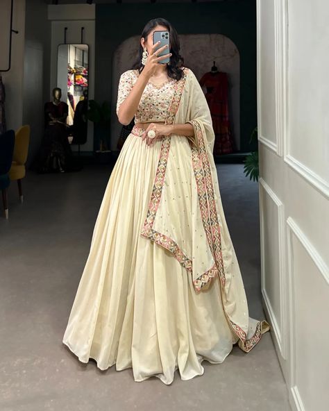 "Make a mesmerizing statement in our off-white lehenga choli! ��🌷✨ Exquisite embroidery, shimmering sequins, and unparalleled elegance. Capture hearts and steal the spotlight effortlessly! #weareffortlessly #LehengaCholiLove #OffWhiteElegance #EmbroideredPerfection #SequinSparkle #FestiveFashion #EthnicChic #WeddingWear #LehengaGoals" ▪️Lehenga(Stitched) Lehenga Fabric : Georgette Lehenga work : Sequins and Thread Embroidery Work With Lace Border Lehenga Waist : SUPPORTED UP TO 42 Lehenga Cl... Zip Stitching, Lehenga Stitched, White Lehenga Choli, Sequins Lehenga, Embroidery Work Blouse, Reception Gowns, White Lehenga, Lehenga Dupatta, Georgette Lehenga