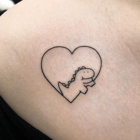 Dinosaur heart tattoo Dinosaur Heart Tattoo, Friend Dinosaur Tattoos, Cartoon Dinosaur Tattoo, Tattoo Dino, Tattoo Dinosaur, Anniversary Tattoos, Lil Tattoos, Insect Tattoos, Dino Tattoo