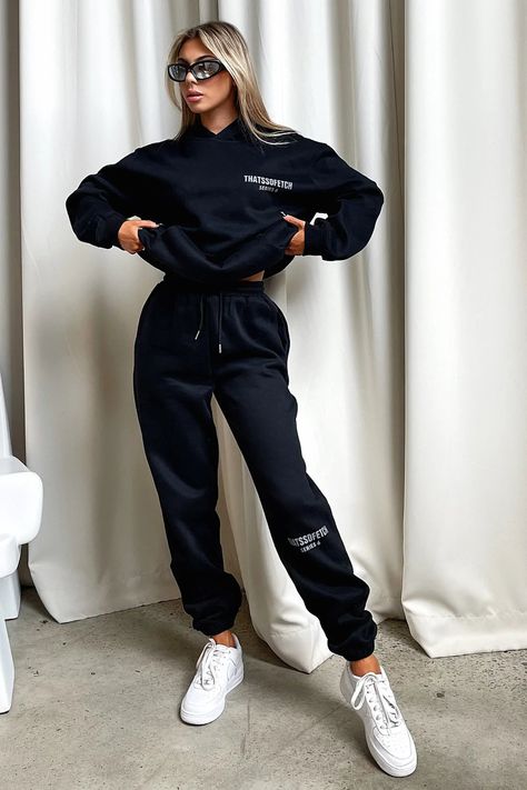 Living boujee and lounging in style! The Series 6 Sweatpants offer a soft fleeced inside, elasticated waistband with tie up drawstrings, a 'THATSSOFETCH' logo at the knee and cuffed ankles. Pair with the matching hoodie, sneakers and sunnies for a casual Sunday vibe. FABRICATION: 65% Cotton 35% Polyester SIZING: Olivia's height is 163cm / 5'3 and wears a size AU6/US2. Hoodies For Ladies, Sweatpants Outfit Photoshoot, Cute Sweat Suit Outfits, Black Sweatpants Outfit Women, Sweatpants Photoshoot Ideas, Sweat Pants Outfit, Sweat Set Outfits, Long Cape Coat, Black Runners