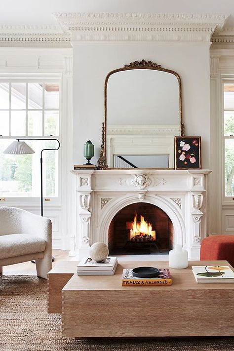 The Anthropologie mirror is basically social media famous, and I found the best Anthropologie mirror dupes online with the same antique look. Vintage Mirror Above Fireplace, Brass Mirror Above Fireplace, New Orleans Decor Interiors Living Room, Gold Vintage Living Room, Large Mirror Over Fireplace Living Room, Dark Academia Fireplace Mantle, Large Mirror Over Fireplace, Mantle Mirrors, Modern Victorian Living Room