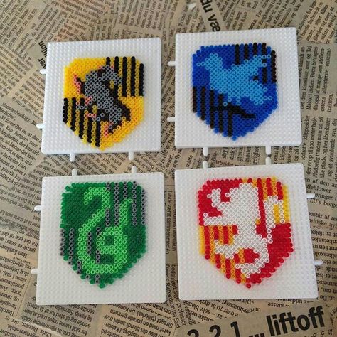 Hogwarts houses Hama Beads Pattern, Harry Potter Perler Beads, Harry Potter Crest, Cumpleaños Harry Potter, Melty Bead Patterns, Anniversaire Harry Potter, Fuse Bead Patterns, Art Perle, Recipes For Picky Eaters Adults