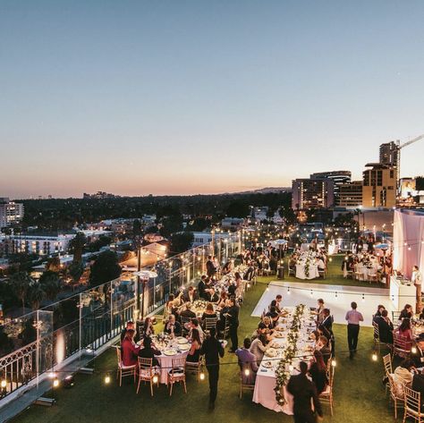 This classic rooftop wedding at the London Hotel was perfect for this beautiful Los Angeles night. The hotel provided a gorgeous view of the cityscape while maintaining an intimate feel. Lush runners of greenery and blooms cascaded over the ends of the longer tables. Elegant furniture and decor displayed accents of gold and navy.  www.bestbride.la https://www.instagram.com/bestbride_/ http://www.bestbride.la/galleries/candace-scott/ #wedding #white #rooftop #photography #navy #gold Wedding Ideas Rooftop, Rooftop Reception Decor, Rooftop Terrace Wedding Decor, Rooftop Party Decorations Night, Rooftop Graduation Party, Rooftop Event Decor, Rooftop Bar Wedding, Rooftop Wedding Reception Decor, Rooftop City Wedding