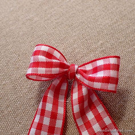 How to Make Small, Consistent Bows + Give-Away Winner! – NeedlenThread.com Tying Small Bows, How Make A Bow With Ribbon, How To Make Small Ribbon Bows, How To Tie Bow For Wreath, Craft Bows Diy How To Make, Making Small Bows, How To Tie Small Bows, Mini Bows Diy How To Make, How To Tie A Small Bow With Ribbon