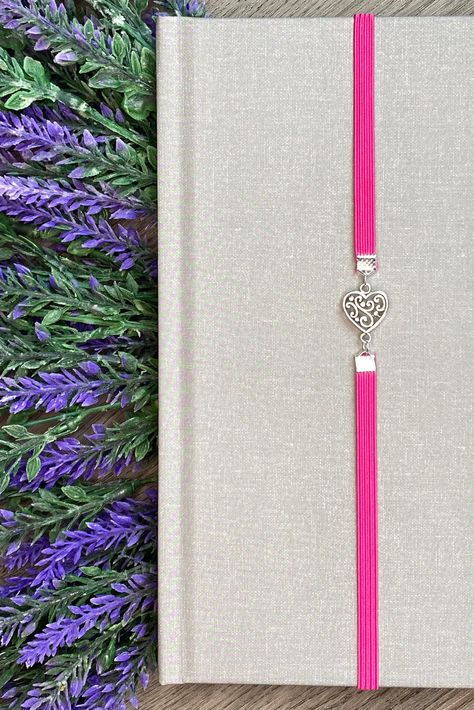 Finally, a bookmark that won't fall out! This metal charm is on an elastic band that will fit virtually any book and, unlike traditional bookmarks, will stay exactly where you left it. Simple, beautiful, and functional, this bookmark is a must have. Elastic Bookmarks, Charm Bookmark, Jewelry Making Project, You Left, Metal Charm, Any Book, Book Accessories, Hardcover Book, Large Prints