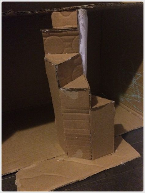 Take your DIY cardboard dollhouse to the next level by making a spiral staircase, cardboard furniture, and more Diy Cardboard Dollhouse, Dollhouse Staircase, Playhouse Furniture, Diy Karton, Cardboard Construction, Paper Spiral, Cardboard Fireplace, Cardboard Houses, Cardboard Dollhouse