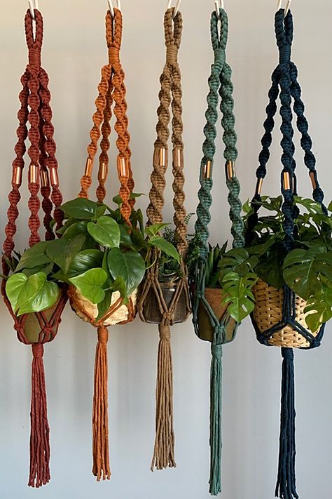 **Please note that all sales are final.** u00a0 Add a breath of fresh air to your home by hanging some of your favorite plants. The combination of the twisted cord and copper embellishments will bring that perfect modern boho flare to any room. Each plant hanger is made out of 100% recycled cotton cord and can hold up to a pots size of 6” wide. Pots and plants not included. u00a0 **Contents** * 100% recycled cotton * Copper beads u00a0 **Care/Import** * Hand wash * Handmade in the USA u00a0 **Dimensions** *36” long from top of hanger to the end of tassel | I Would Rather Knot Macrame Plant Hanger With a Twist at Free People in Red Macrame Hoop Plant Hanger, Macrame Pumpkin Hanger, Decorating House With Plants, Hanging Plant Macrame Diy, Boho Plant Hanger, Wall Hanging Decorations, Crazy Crafts, Knot Macrame, Indoor Plant Hangers