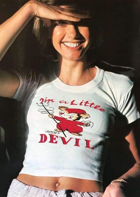 Olivia Newton John rocking a' I'm a little devil shirt' 70s Lookbook, Olivia Newton John Young, Sandra Dee, Olivia Newton, Female Musicians, Olivia Newton John, Farrah Fawcett, Retro Nostalgia, Studio 54