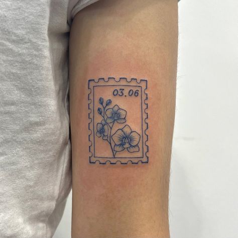 𝕸𝖊𝖌𝖚𝖒𝖎 恵 on Instagram: “Stamp tattoo in blue ink🐬 Thank you so much for the trust Jamille🤍 #stamptattoo #smalltattoo #bluetattoo #orchid #sydneytattoo…” Blue Stamp Tattoo, Orchid Stamp Tattoo, Stamp Tattoos For Women, Mail Design Ideas, Stamp Tattoo Ideas, Mission Tattoo, Post Stamp Tattoo, Medical Tattoos, Postage Stamp Tattoo