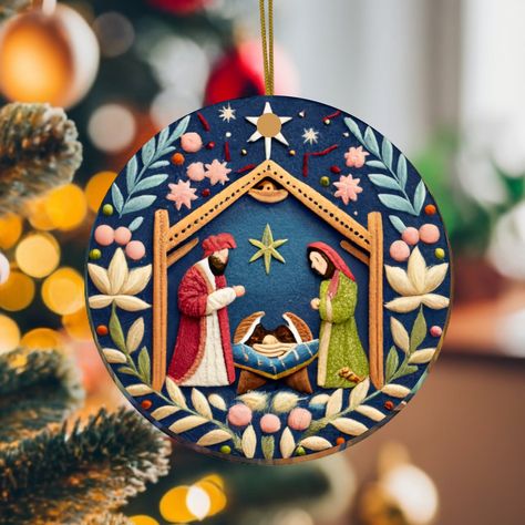 Introducing our captivating 2.75 inch Nativity Painting Christmas Ornament, not real embroidery, but meticulously printed on durable ceramic! This ornament showcases a beautiful manger scene that will infuse your holiday decor with warmth and wonder. 🌟 **Celebrate the Nativity Immerse yourself in the timeless Nativity story with this masterfully painted ornament. Every brushstroke, from Mary, Joseph, and Baby Jesus to the humble animals, is a work of art that brings this cherished tale to life. 🖼️ **High-Quality Ceramic Print This isn't your average ornament; it's a high-quality ceramic print that captures the essence of the Nativity scene with vivid colors and intricate details. The charm of the painting radiates brilliantly. 🎄 **Effortless Holiday Decor Hanging this ornament is a bree Nativity Painting, The Nativity Story, Unique Christmas Decorations, Nativity Ornaments, Painted Christmas Ornaments, Meaning Of Christmas, True Meaning Of Christmas, Christmas Room Decor, Thanksgiving Celebration