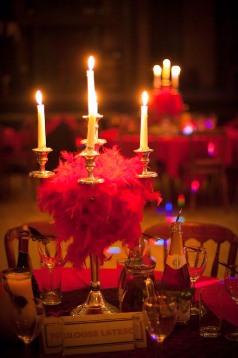 Moulin Rouge wedding cabaret decor, set up in old Georgian theatre. Red feather boas wrapped around candelabras. Moulin Rouge Themed Party, Moulin Rouge Party Ideas, Moulin Rouge Party Food, Moulin Rouge Hen Party, Cabaret Party Ideas, Cabaret Centerpieces, Cabaret Party Theme, Burlesque Decorations, Moulin Rouge Decorations