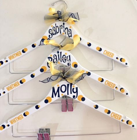 Uniform hangers personalized for Cheerleaders, Varsity/JV Cheer, Big sis/lil sis, Dancers, Drill team, Secret Santa, Christmas team gifts All hangers can be customized with your name or team. You can also add your sport, gym, school or mascot. As well as any color combination.  Hangers are wooden and approximately 17 wide. Available in white or black. All hangers have clips to use for skirts or bows. They are decorated using your choice of colors and finished with coordinating ribbon and tulle. Cheerleading Team Gifts, Senior Cheerleader, Cheer Banquet, Cheer Team Gifts, Cheerleading Coaching, Dance Team Gifts, Cheerleading Team, Cheer Camp, Drill Team