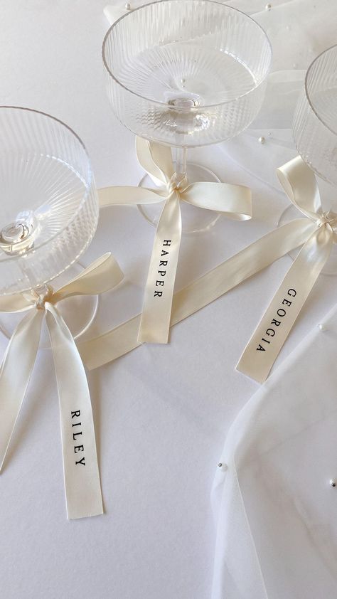 CREO | I’m in loveeee… personalised ribbons 🤍🥂 Everyone is loving bows and ribbons this season, and I adore this trend for event decor. So I am… | Instagram Drink Tags, Personalized Ribbon, Wedding Name, Bridesmaid Proposal Gifts, Wedding Drink, Wedding Bows, Wedding Ribbon, Printed Ribbon, Proposal Gifts