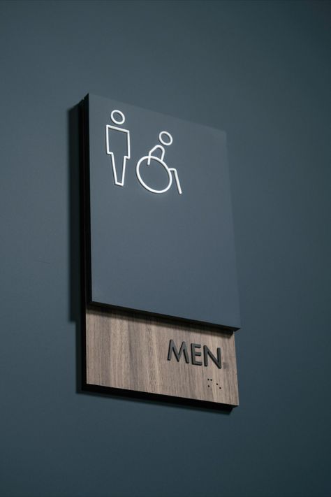 Restroom sign with modern two-layer design using woodgrain and solid laminate. Office Signage Design Interiors, Wc Sign Design, Modern Signage Design, Signage Design Ideas, Wc Signage, Office Signage Design, Modern Restroom, Hotel Wayfinding, Restroom Signage