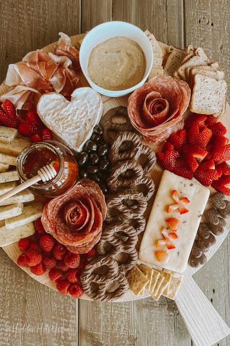 Valentine’s Day inspired charcuterie board with heart shaped fruit, cheese, chocolate, and snacks! Happy Galentine’s Day Food, Valentines Party Charcuterie Board, V Day Charcuterie Board, Charcuterie Board Themes Valentines, Board Party Ideas Valentines, Small Valentine Charcuterie Board, Simple Valentines Charcuterie Board, Galantines Day Charcuterie Board, Galantines Day Food Ideas