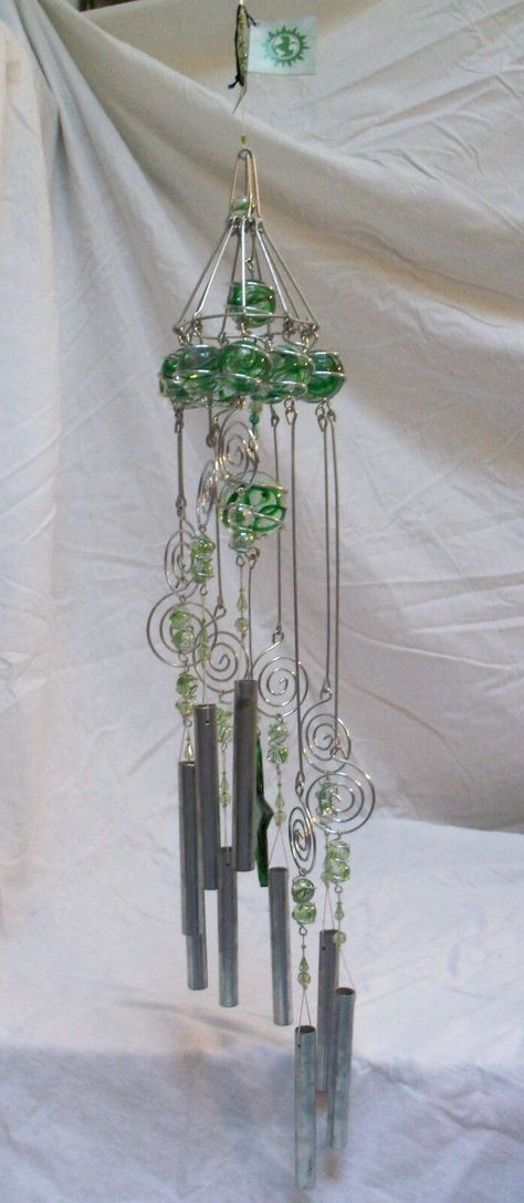 Handcrafted large & heavy (4 1/2 lbs) aluminum, glass balls with swirled green color, and acrylic beads wind chime. Total length including the hanging chain and chimes is 39". total length without the hanger length is 32". Diameter of the top ball circle is 6". Aluminum tubes are 5". Star is 4". Largest ball is 2". New with original tags from Care & Wonder Company, Inc. based in California. Windchimes Homemade, Handmade Windchimes, Capiz Wind Chimes, Wind Chimes For Sale, Large Wind Chimes, Glass Bead Crafts, Wine Bottle Wind Chimes, Crystal Wind Chimes, Glass Bottle Diy