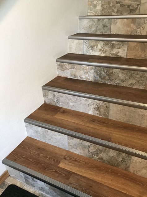 My stairs finally finished! Luxury Vinyl Plank on the treads, which matches the upstairs rooms. Porcelain tile on the risers, which matches the Den, Foyer and Baths. Schluter stair nosing for a transitional look. Tile For Stairs Staircases, Wood Look Tile Stairs, Stair Nosing Ideas, Indoor Steps Ideas Stairs, Travertine Stairs, Tiles For Stairs, Tiles Stairs, Laminate Flooring On Stairs, Stairs Vinyl