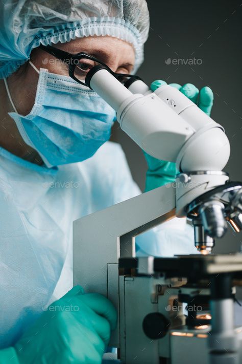 Scientist in blue medical gloves and uniform learning samples with microscope in laboratory. Microscope Laboratory, Medical Laboratory Science Student, Future Drawing, Medical Lab Technician, Tech Outfit, Medical Laboratory Scientist, Medical Photography, Medical School Life, Laboratory Technician