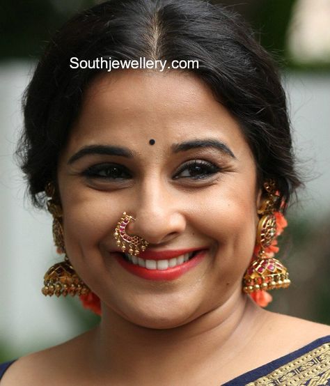 Vidya Balan in antique gold long jhumkas studded with kundans paired with kundan nose ring and kundan kada. Kundan Kada, Kundan Jhumkas, Bridal Nath, Nose Ring Designs, Faux Nose Ring, Bridal Nose Ring, Nose Ring Jewelry, Snake Girl, Nose Pins