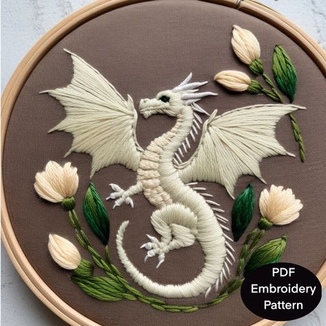 Hand Embroidery pattern template for a fantasy dragon with floral  elements. The pattern is available in 3.4,5,6,7,8 and A4 sizing to fit a variety of embroidery hoops. This digital download is for the pattern only as no instructions are included for stitching or for thread types or colors other than the reference photo of the design. What's Included  🪡 Digital PDF file suitable for printing at home or at a copy shop 🪡 Basic stitches for embroidery "how-to" sheet 🪡 How to transfer designs usi Fabric Bag Design, Dragon Embroidery, Digital Embroidery Patterns, Dragon Decor, Embroidery Stitches Tutorial, Creative Embroidery, Dragon Pattern, Embroidery Designs Fashion, Hand Embroidery Design Patterns