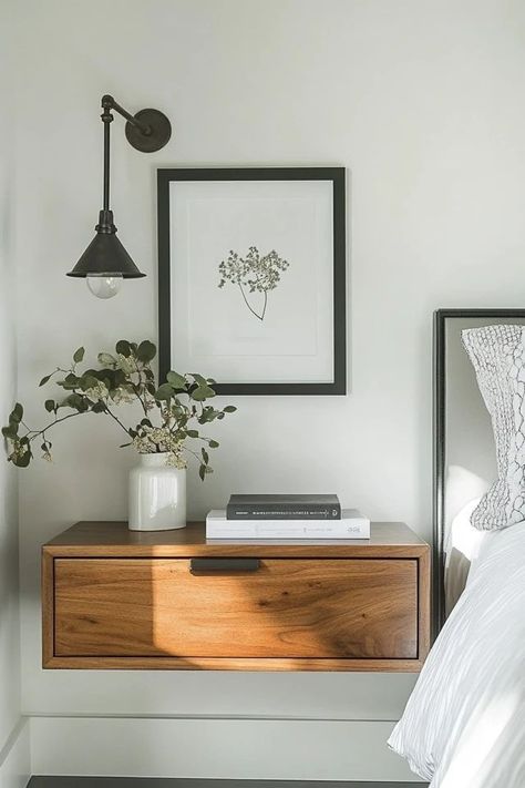 "Maximize space and style with floating nightstands! 🛏️✨ Perfect for creating a sleek, modern look in your bedroom. 🌟✨ #FloatingNightstand #BedroomDesign #SpaceSaving" Art Above Nightstand Bedside Tables, Hanging Light Over Nightstand, Floating Nightstands Bedroom, Floating Night Stand Ideas, One Nightstand Bedroom Layout, Bedroom Floating Nightstand, Floating Side Tables Bedroom, Floating Nightstand Bedroom, Floating Headboard With Nightstands