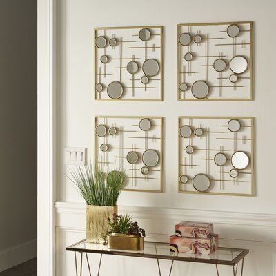 Everly Quinn This 4-piece gold square wall mirror with bubbles instantly elevates your walls with luxury and glamour. This eye-catching mirror features a modern design with sleek, square iron frames, clean-cut lines, and bubble-shaped mirrors, all of which are tied together by a gorgeous gold finish. Four matching pieces are included in this accent mirror, perfect for those who love to change things up. Cluster the pieces together for a statement look or scatter them throughout your home for a m Lv Decor, Hot Glue Art, Square Wall Mirror, Wall Mirrors Set, Diy Dollar Tree Decor, Dollar Tree Decor, Accent Mirror, Round Wall Mirror, Mirror Set