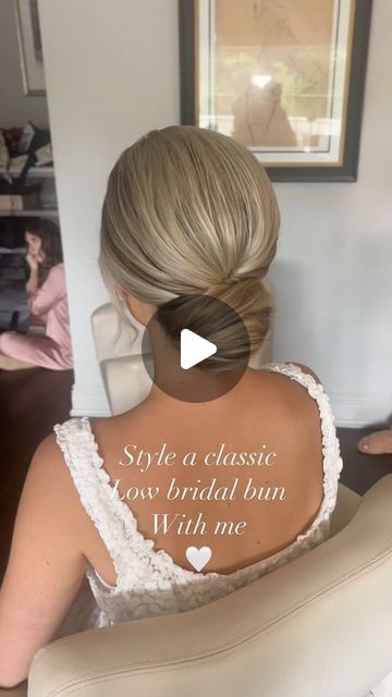 Kristen Okaly on Instagram: "Danielle 🤍 classic low buns always 🫶🏻 Mua @byalyssaa  . @sexyhair powder play . #bridalbun #updotutorial #njbridalhair #njhairstylist #updoeducator #njbride #brideinspiration #weddingreels #bridereels #parkchateauwedding #bridalhairstyle #classicbridalhair #bridalhairideas #njweddings #updoideas #bridetobe2025" Low Classic Bun Wedding Hairstyles, Wedding Low Bun Hairstyles How To, Bridal Hair Low Bun Blonde, Low Hairstyles Wedding, Bun Hair Updos, Low Bun Updo Medium Hair, Low Bun Wedding Hair Fine Hair, Wedding Low Bun Short Hair, Earrings With Updo Hair