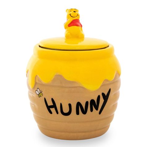 Stash your snacks in style with this fun Disney Winnie the Pooh snack jar! Fun and functional, this snack jar makes a great conversation piece in your kitchen. Officially licensed. Produced by Silver Buffalo, a trendsetting housewares and home decor company based in the heart of New York City. A Toynk exclusive! Winnie The Pooh Hunny Pot, Pooh Hunny Pot, Winnie The Pooh Hunny, Clay Cafe, Snack Jar, Ceramica Ideas, Hunny Pot, Winnie The Pooh Honey, Disney Coffee Mugs