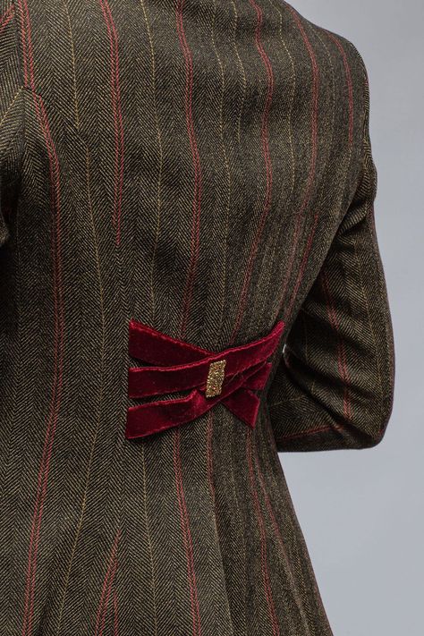 Wool tweed w/ silk velvet under cuffs, on collar, pocket trim, and criss-cross back detail Decorative brass metal buttons Fit is true to size. Model wears size 38 Made in Spain