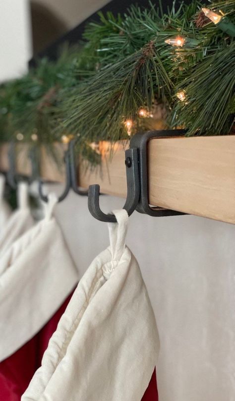 Perfect as a Christmas Stocking Holder, these Custom Mantel Hooks add Farmhouse charm to your Christmas Decor. KubieSteelCo is a local Peterborough business that makes shelf brackets, bench legs, saddle racks, gun racks and more! We are passionate about creating spaces you love to spend your time in. All of our steel is locally sourced and hand crafted ensuring the highest quality products. We help you achieve modern, farmhouse and industrial decor. Christmas Stocking Holders For Mantle, Fireplace Stocking Holders, Apartment Stocking Hanging, Christmas Stocking Hooks, Hanging Stockings On Mantel, Stocking Hangers Mantle, Stocking Hooks Mantle, Stocking Holders For Mantle, Stocking Hangers