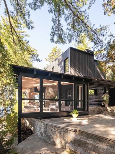 A Black Exterior And New Living Spaces Were Part Of Remodeling An Old Log Cabin Into A Contemporary Home Contemporary Cabin, Stone Fireplace Surround, Small Log Cabin, Rustic Log Cabin, New Staircase, Cottage Renovation, Timber Beams, Old Cottage, Lake Cottage