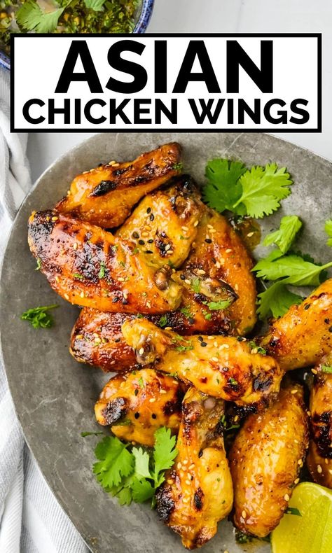 These Asian chicken wings are the best we've ever tried. They're spicy, sweet, tangy and delicious. The Asian chicken wing recipe uses honey, lime juice sriracha, soy sauce, garlic and a bit of fish sauce to flavor the marinade and dipping sauce. You'll love these Asian-style wings for munching as an appetizer or even dinner. Asian Wing Sauce, Wingette Recipes, Soy Sauce Fish, Chinese Chicken Wings, Chicken Wing Marinade, Asian Chicken Wings, Honey Sriracha Sauce, Food Noodles, Dipping Sauces For Chicken