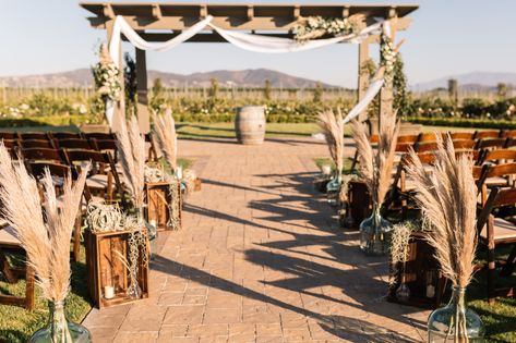 Pampas Grass In Jugs Wedding, Glass Jugs Wedding Decor Ideas, Glass Jug Wedding Decor, Wedding Podium, Wedding Crates, Wedding Alter, Wedding Alters, Faux Candles, Katie May