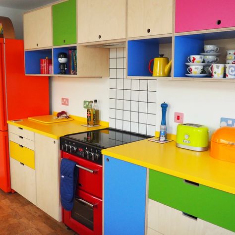 Bright and fun modern kitchen - super colourful with yellow worktop and plywood and formica cupboards with open shelving. Very fun quirky kitchen! Quirky Kitchen Decor, Clothing Prints, Colourful Kitchen, Plywood Kitchen, Quirky Kitchen, Urban Interiors, House Things, Kitchen Decor Items, Dream House Decor