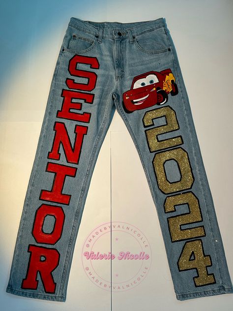 Graduation Pants Ideas, Senior Jeans Patches, Homecoming Jeans Ideas Freshman, Black Senior Jeans, Lightning Mcqueen Graduation Cap, Senior Pants Ideas 2024, Senior Jeans Painted 2024 Ideas, Senior Pants 2025, Senior Pants Ideas 2025