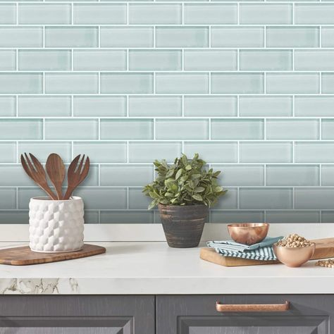 "Find the Aqua Seaglass Subway Peel And Stick Sticktile atr Michaels. com. Classic subway tile peel and stick backsplash is now available in aqua seaglass color option for on trend décor solutions. Classic subway tile peel and stick backsplash is now available in aqua seaglass color option for on trend décor solutions. RoomMates’ Aqua Seaglass Subway peel and stick StickTiles have a 3D glossy finish, giving you the look and feel of genuine designer tiles. But unlike real tiles, you do not need h Seaglass Backsplash Kitchen, Sea Glass Backsplash Kitchen, Sea Glass Tile, Traditional Backsplash, Glass Backsplash Kitchen, Tile Peel And Stick, Room Mates, Designer Tiles, Roommate Decor