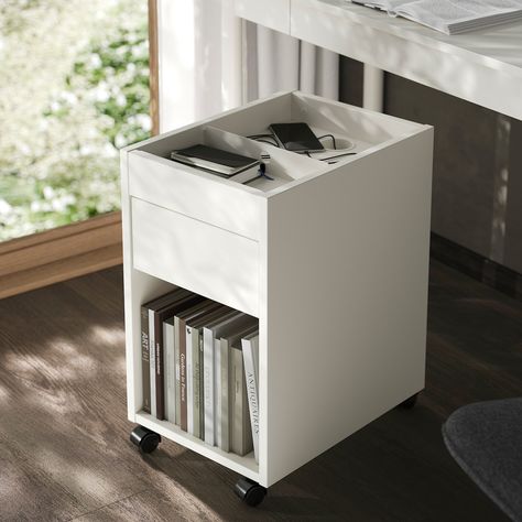 Stylish drawer unit with a simple design and practical castors so you can move it to where it’s needed. Compact and easy to place – perfect for keeping your small items hidden, yet close at hand. TONSTAD drawer unit on castors, off-white, 35x60 cm. Workspaces. Small Space Office Storage, Hidden Printer Cabinet, Hidden Printer, Printer Station, Printer Cabinet, Rolling Desk, Under Desk Storage, Sample Box, Space Interiors