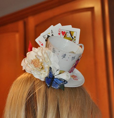 alice in wonderland teacup hat client pic 1 by spookykitten, via Flickr The hand of  playing cards arranged behind the cup and saucer is so cute. Party Fashion Photography, Teacup Hat, Alice In Wonderland Hat, Mad Hat, Alice Tea Party, Mad Hatter Party, Alice In Wonderland Costume, Mad Hatter Hats, Wonderland Costumes