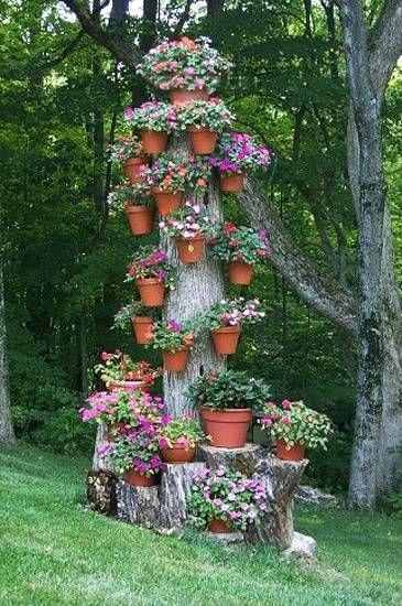 11 pictures of crazy cool uses for tree stumps, outdoor furniture, outdoor living, repurposing upcycling, woodworking projects, Photo via Lushome Natural Landscaping, نباتات منزلية, Flower Tower, Potted Flowers, Desain Lanskap, Have Inspiration, The Secret Garden, Tree Stump, Civil Engineering