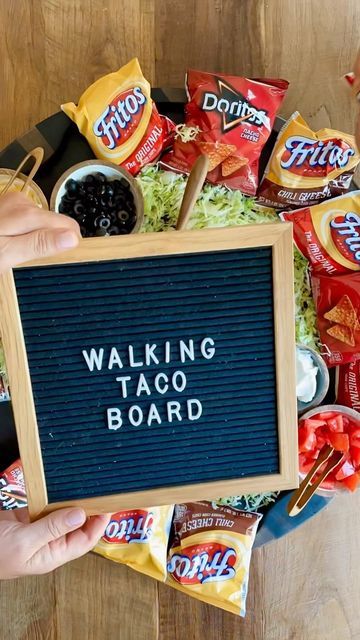 ReluctantEntertainer.com® on Instagram: "The original Walking Taco Board for Halloween! Grab your big board + this easy recipe. Link in bio https://reluctantentertainer.com/epic-walking-taco-board-recipe/ #reluctantentertainer #walkingtacos #walkingtacoboard #halloweenwalk #halloween🎃 #halloweenparty #tacostacostacos" Fall Entrees, Taco Board, Walking Taco, Walking Tacos, Big Board, Nye Party, Tex Mex, Grad Parties, Big Game