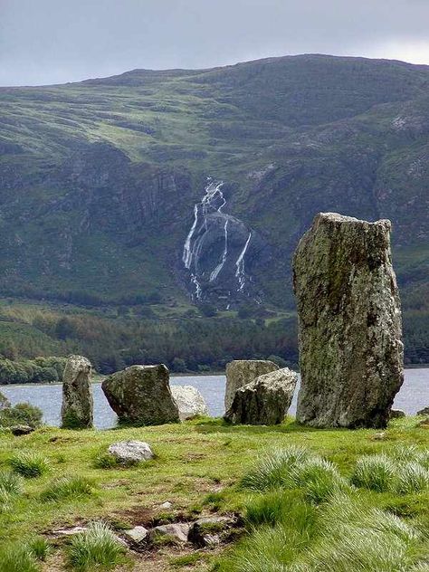 Uragh Stone Circle, County Kerry, IrelandUragh Stone Circle is a neolithic stone circle near Gleninchaquin Park. Situated near Lough Inchiquin, it consists of five megaliths. The largest stone is ten feet high and the circle is eight feet in diameter. There are two brilliant quartz stones at the south, as well as one off center within the ring. Stone Circles, Ancient Ireland, Kerry Ireland, Stone Circle, Standing Stones, County Kerry, Irish Eyes, Standing Stone, Image Nature