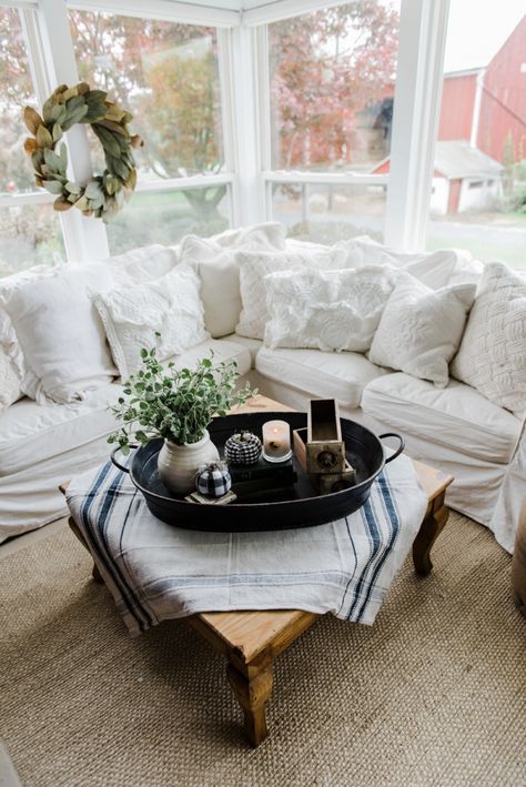 Farmhouse style coffee table in the sunroom - A lovely warm wood style coffee table style with a tablecloth on top to cozy it up. A great source for farmhouse & cottage style home decor! Farmhouse Sunroom, Farmhouse Style Coffee Table, Dining Centerpiece, Farmhouse Style Living Room, Farmhouse Tray, Black Farmhouse, Sunroom Decorating, Sunroom Designs, Cottage Style Home