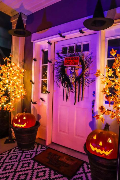 How to Decorate Your Front Porch for Halloween on a Budget: 21 Easy and Inexpensive Ideas - Practical Perfection Halloween Lights Front Porch, Front Porch Witch Decorations, Witchy Porch Ideas, Halloween Apartment Decor Front Doors, Halloween Lights Outdoor Porch, Maxamilist House, Halloween House Decorations Outdoor, Gothic Patio, Halloween Porch Lights