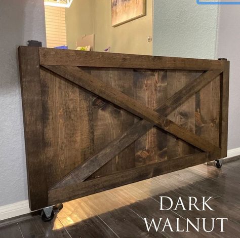 "This listing is for a 24\"x44\"x1.5\" farmhouse baby gate with all the hardware included (wheels and brackets) it's the perfect space saver to keep your babies safe from stairs, stoves, etc. If you need a custom size, message me and we'll be happy to provide a quote The color in the first picture is provincial, the color in the second picture is Ebony" Rolling Baby Gate, Indoor Gates, Diy Dog Gate, Barn Door Baby Gate, Dancing Frog, Diy Baby Gate, House Rules Sign, Dog Gates, Half Doors