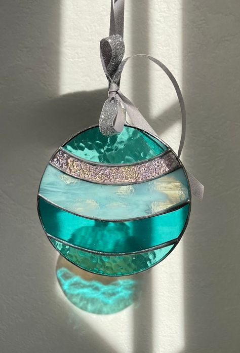 "Make your Christmas merry and bright with these festive Stained Glass Christmas Suncatchers or Tree Ornaments! Buy one or purchase a set of three. Perfect for adding that extra touch of holiday cheer🎄  Available in three designs and two color options:  Festive Multicolor or Winter Blues  Ball measures 4.25\" round Drop measures 5.5\"H x 3.75\"W Oval shape with Stars measures 5.25\"H x 4.5\"W The Festive Multicolor ornaments come with a red velvet ribbon while the Winter Blues come with a spark Hanging Stained Glass, Cat Stain, Stained Glass Ornaments, Glas Art, Stained Glass Christmas, Stained Glass Diy, Glass Christmas Tree Ornaments, Stained Glass Crafts, Stained Glass Designs