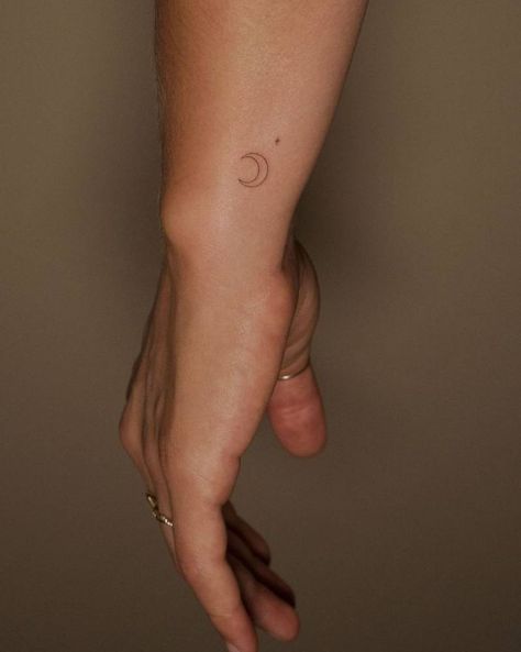 Unique Small Moon Tattoo, Minimal Crescent Moon Tattoo, Tiny Moon Tattoo Wrist, Waxing Crescent Moon Tattoo Small, Moon On Wrist Tattoo, Small Moon Tattoo Placement, Moon Micro Tattoo, Dainty Moon Tattoos For Women, Luna Moon Tattoo