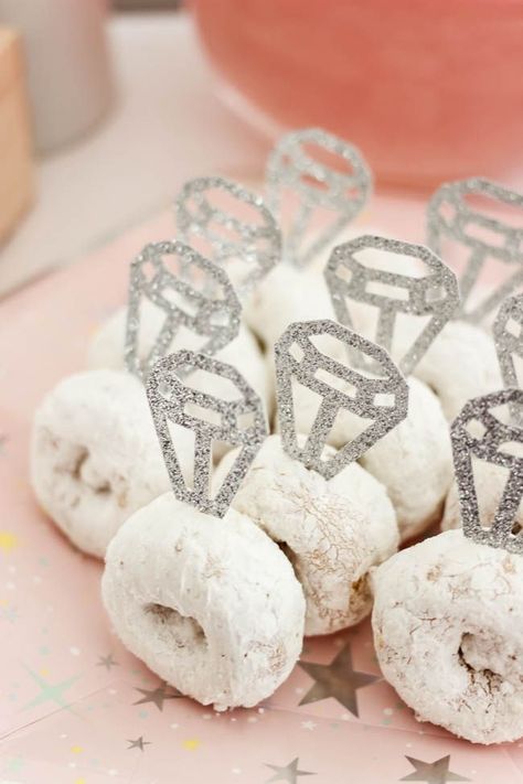 Cute donut rings! Beautiful Bridal Shower Decorations for the Modern Bride! Decorate with the Iridescent Martha Stewart Celebration Line, and personalize your party with the Cricut Explore 2! You're bride will be thrilled with the subtle glitter and glam in these pink and silver decorations! #cricutexplore #bridalshower #modernbride #woodaccents Pink And Silver Bridal Shower Ideas, Simple Modern Bridal Shower Decor, Bridal Shower Ideas Donut, Cute Bridal Shower Decorations, Bridesmaid Party Decoration, Yellow Wedding Shower Ideas, Cricut Projects For Bridal Showers, Pink Glam Bridal Shower, Wedding Stuff Made With Cricut