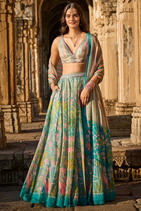 Featuring a powder blue lehenga in cupro lyocell base with digital print and embroidery. It is paired with a contrasting blouse and a dupatta.  FIT: Fitted at bust and waist. COMPOSITION: Cupro lyocell. CARE: Dry clean only. Lehenga Purple, Anita Dongre Lehenga, Indian Outfits Lehenga, Wedding Lehenga Designs, Anita Dongre, Blue Lehenga, Indian Dresses Traditional, Indian Bridal Dress, Indian Gowns