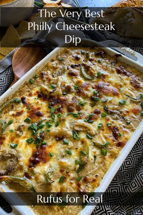 philly cheesesteak dip in a baking dish and garnished with chips and crusty bread for dipping Philly Dip, Philly Cheesesteak Dip, Homemade Philly Cheesesteak, Cheesesteak Dip, Vegan Philly Cheesesteak, Philly Cheese Steak Dip, Best Philly Cheesesteak, Philly Steak, Crock Pot Dips